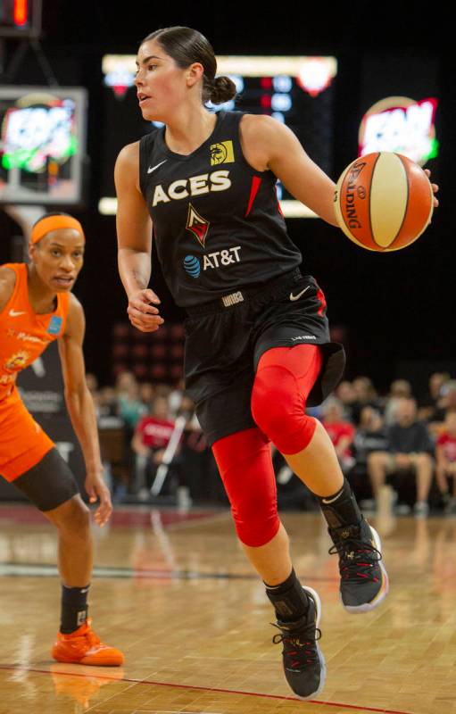 Las Vegas Aces guard Kelsey Plum (10) sets up a play against Connecticut Sun players during the ...