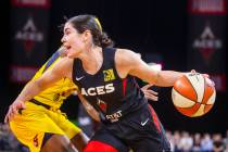 Las Vegas Aces guard Kelsey Plum (10) drives past an Indiana Fever defender to the basket durin ...