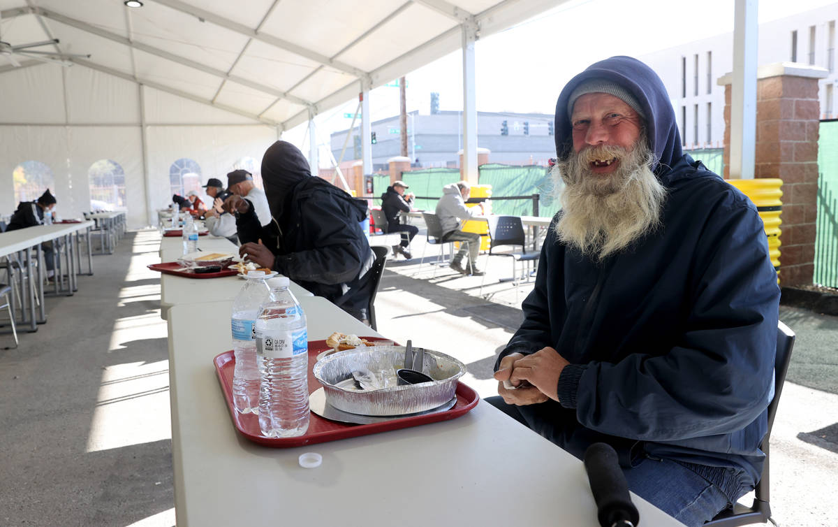 Clients, including Harry Barr, 56, right, eat a socially distanced Thanksgiving meal at the new ...