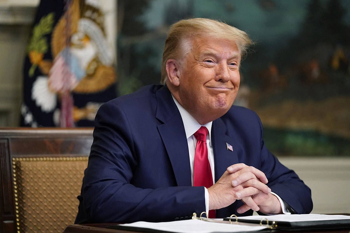 President Donald Trump participates in a video teleconference call with members of the military ...