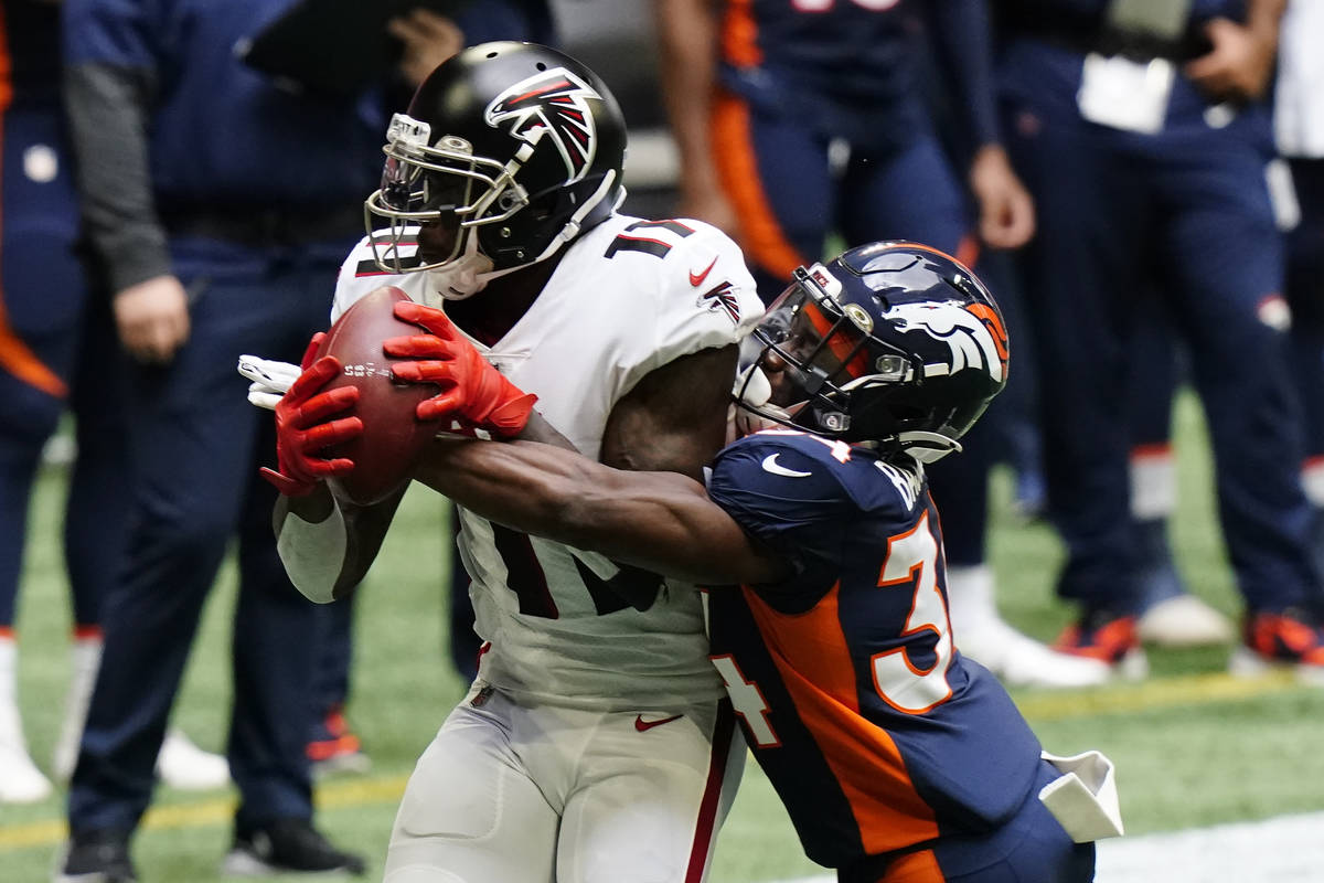 Atlanta Falcons wide receiver Julio Jones (11) makes the catch against Denver Broncos defensive ...