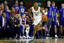 FILE - Baylor guard Jared Butler dribbles up court against Kansas during an NCAA college basket ...