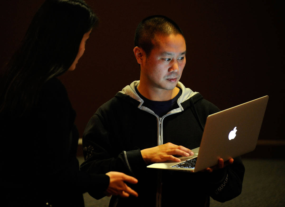 In this Jan. 28, 2012, file photo, Zappos CEO Tony Hsieh works on his laptop computer before th ...