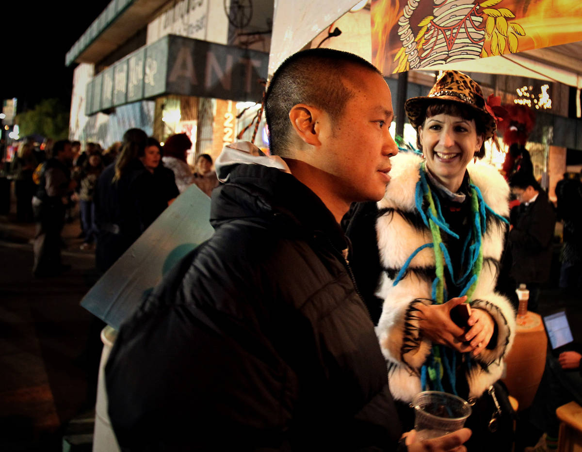Tony Hsieh, CEO of online clothing retailer Zappos.com, talks to artist Nicki Doran during Firs ...