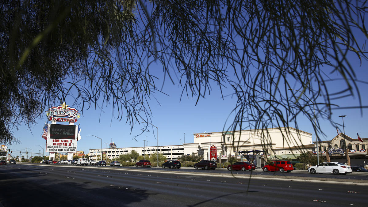 People wait in line at the drive-thru COVID-19 testing site at Texas Station in North Las Vegas ...