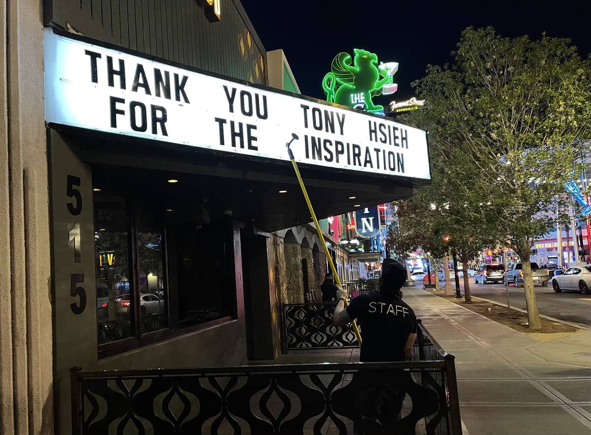 Chris Snook, manager at Corduroy on East Fremont Street, creates a message honoring Tony Hsieh ...