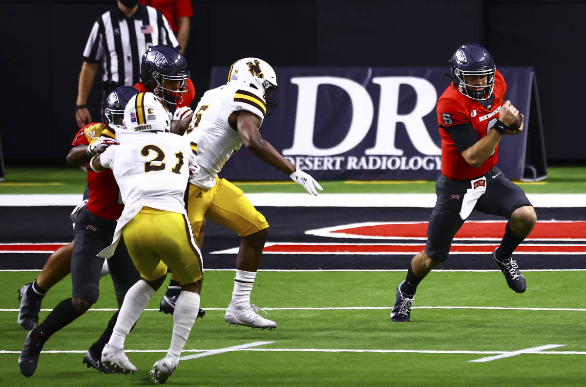 UNLV Rebels quarterback Max Gilliam (6) runs the ball against the Wyoming Cowboys during the fi ...