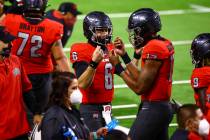 UNLV Rebels quarterback Doug Brumfield (17) celebrates his touchdown against the Wyoming Cowboy ...