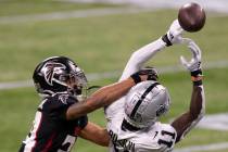 Las Vegas Raiders wide receiver Henry Ruggs III (11) attempts to bring in a catch over Atlanta ...