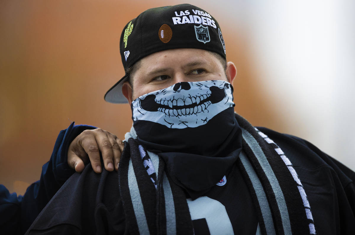Michael De La Cruz, from Los Angeles, Calif., walks to his seat before the start of an NFL foot ...