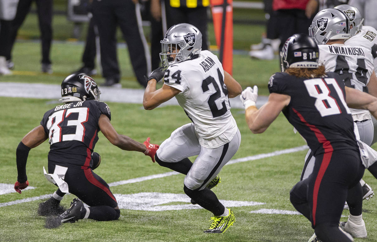 Las Vegas Raiders strong safety Johnathan Abram (24) returns an interception past Atlanta Falco ...