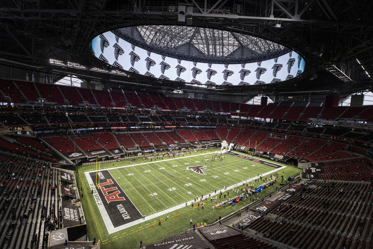 The Atlanta Falcons take the field before the start of an NFL football game against the Las Veg ...