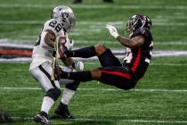 Atlanta Falcons defensive back Darqueze Dennard (34) is hit by Las Vegas Raiders running back J ...