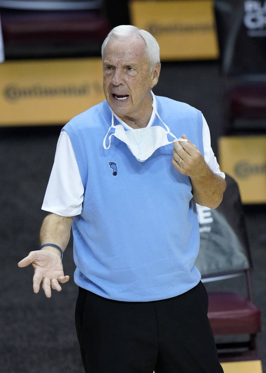 North Carolina head coach Roy Williams directs his team in the first half of an NCAA college ba ...