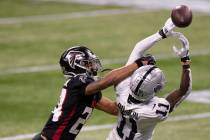 Las Vegas Raiders wide receiver Henry Ruggs III (11) attempts to bring in a catch over Atlanta ...