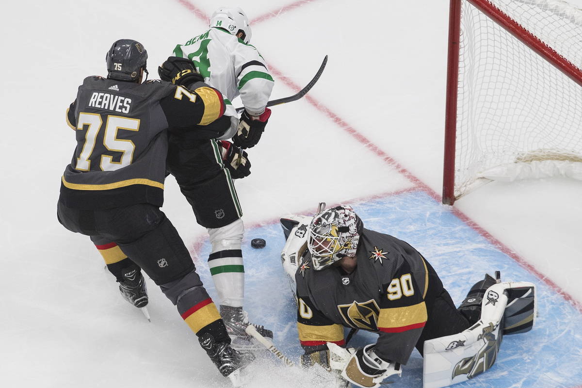 Dallas Stars' Jamie Benn (14) is stopped by Vegas Golden Knights' goalie Robin Lehner (90) as G ...