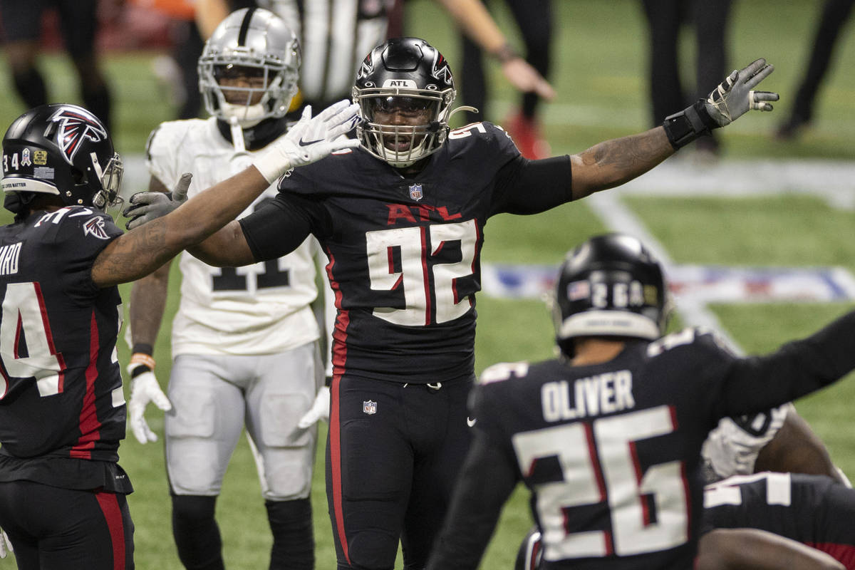 Atlanta Falcons cornerback Darqueze Dennard (34), Atlanta Falcons defensive end Charles Harris ...