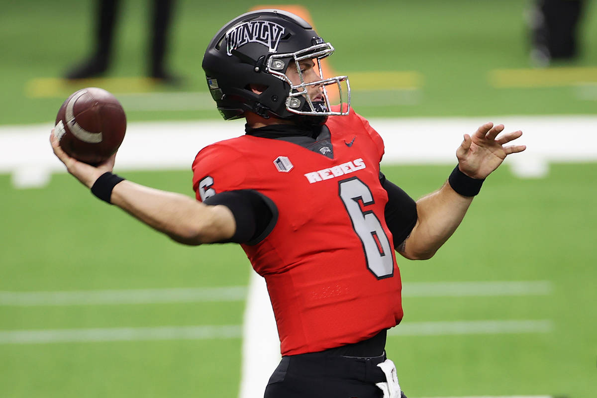 UNLV Rebels quarterback Max Gilliam (6) gets ready to throw a pass as offensive lineman Matt Br ...