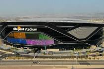 The massive 27,600 square foot video board lights up with color on the Interstate 15 facing por ...