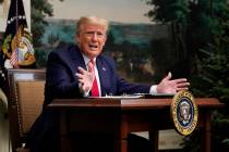 President Donald Trump speaks with reporters after participating in a video teleconference call ...