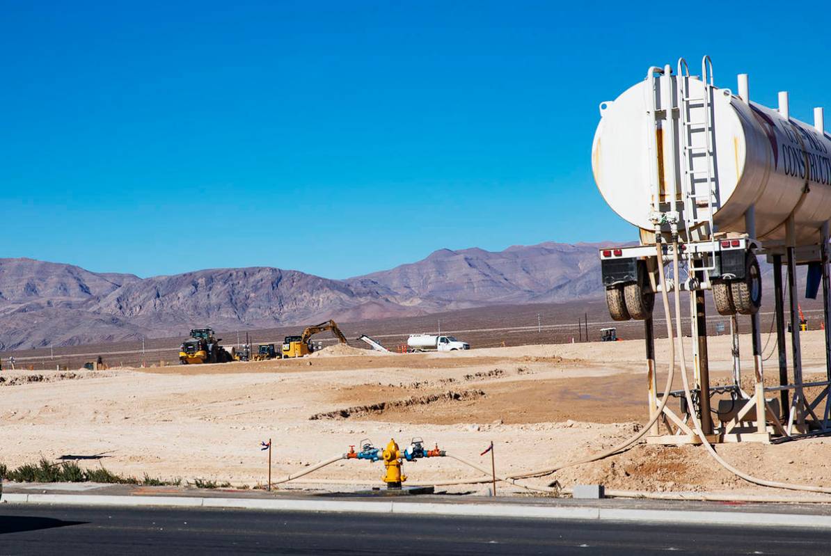 Construction on the future site of an Amazon facility across from the Amazon LAS7 Fulfillment C ...