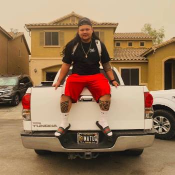 In this September 2018 photo, Kevin Mendiola Jr. poses with his custom-built pickup truck. Mend ...