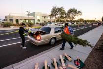 Home Depot volunteer Carlos Rodriguez, right, and Nathan Conrady, a volunteer with Liberty Bapt ...