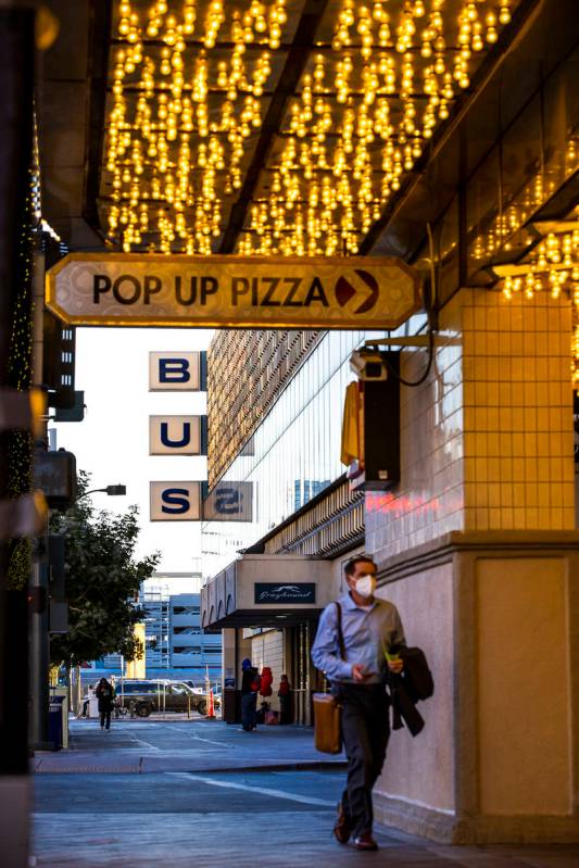 A pedestrian walks along as the Plaza Hotel and Casino announces it will redevelop a building t ...
