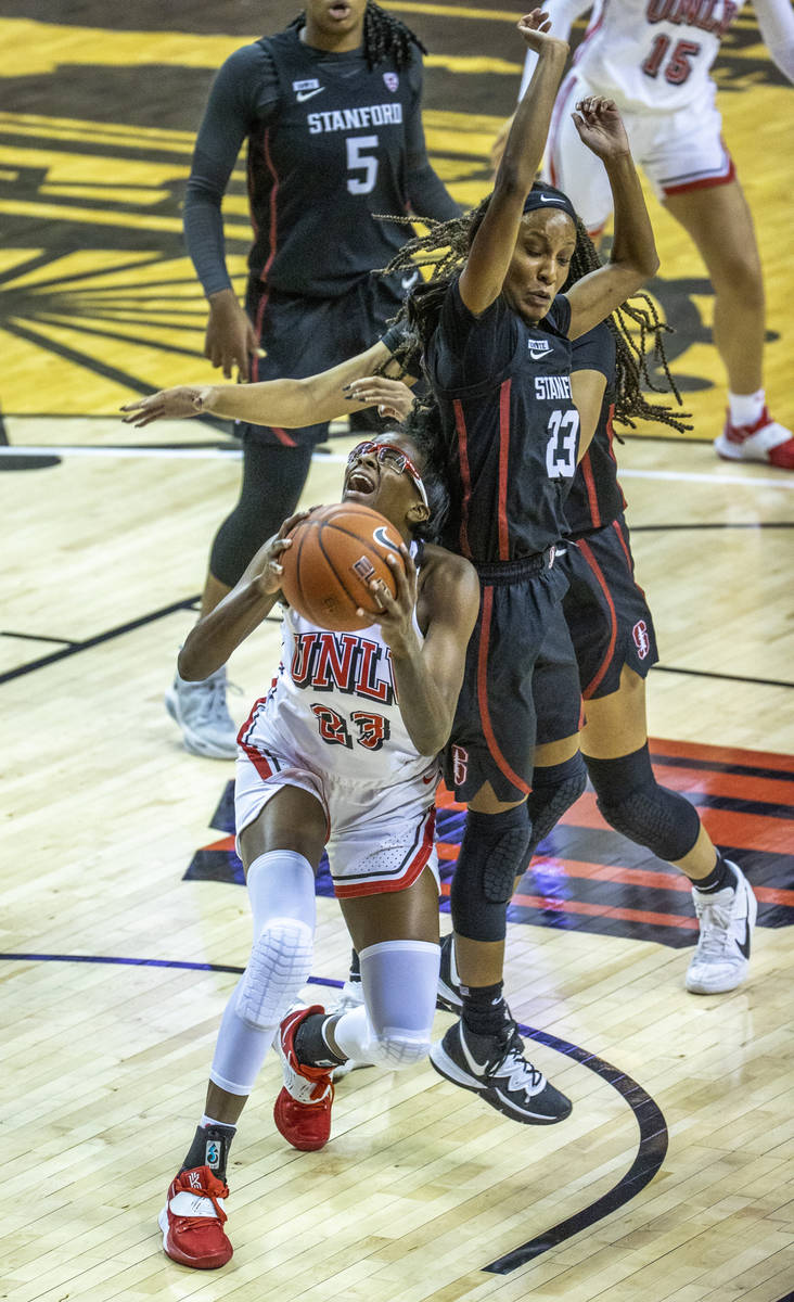 UNLV Lady Rebels forward Desi-Rae Young (23) looks to the basket below Stanford Cardinal guard ...