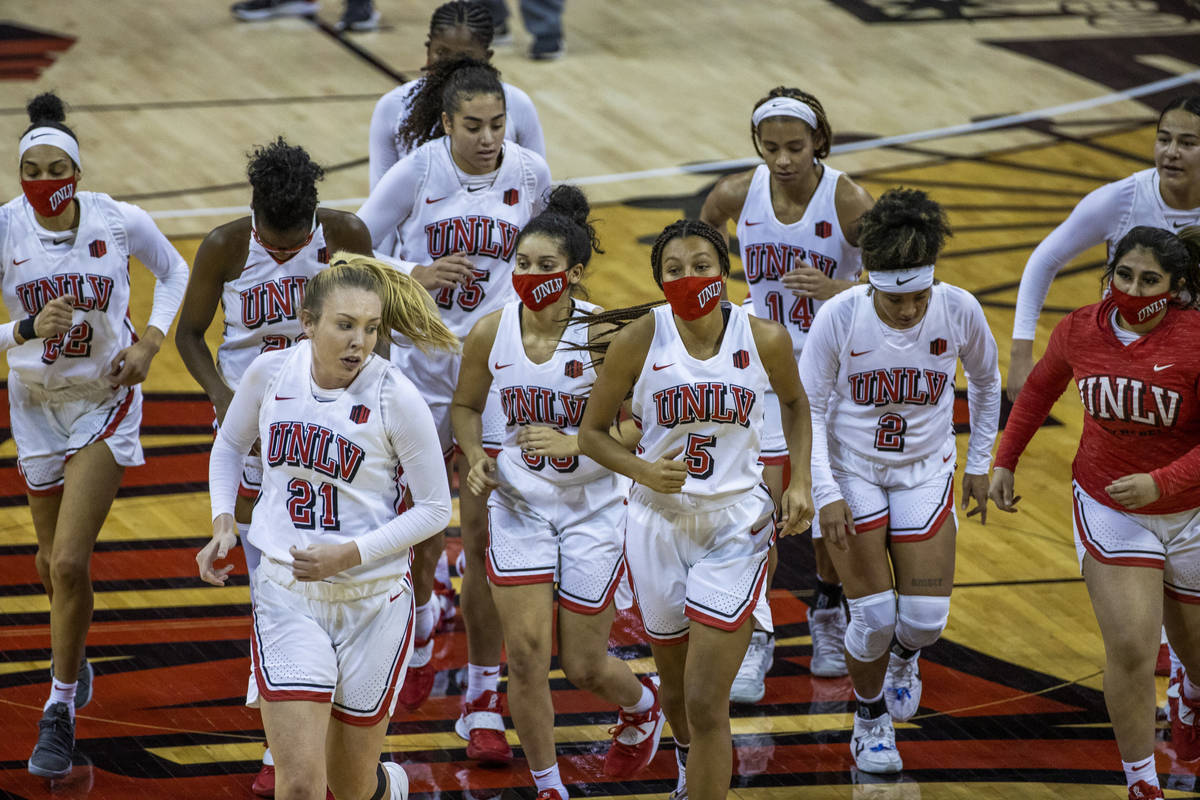 UNLV Lady Rebels' players leave the court after losing to the Stanford Cardinals 101-54 followi ...