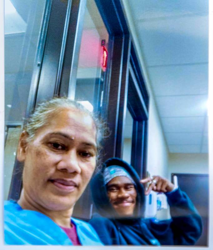 This undated photo shows Evelini Gibbs, left, with her son Genesis Atkins, a motorcyclist who w ...