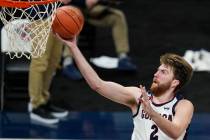 Gonzaga's Drew Timme goes to the basket during the second half of the team's NCAA college baske ...