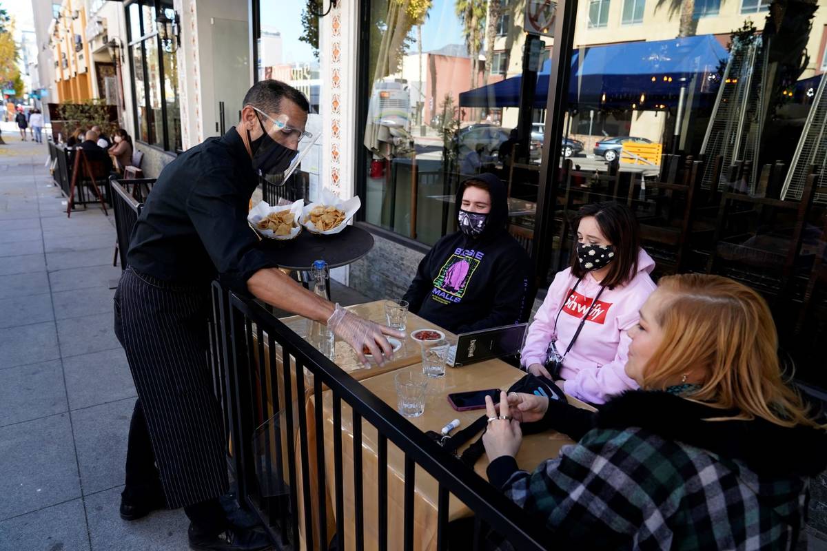 Customers are served lunch at an outdoor seating space Tuesday, Dec. 1, 2020, in Pasadena, Cali ...