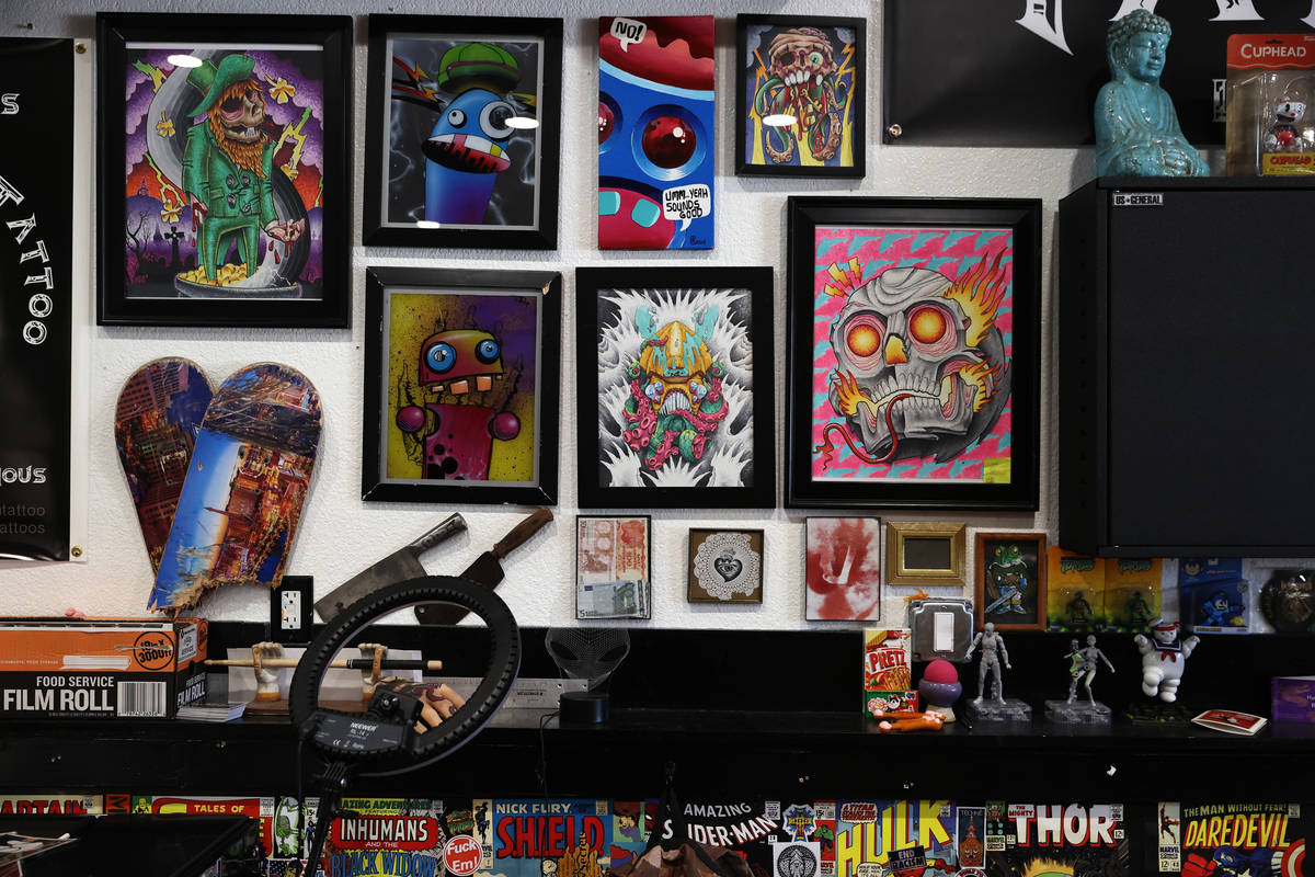 Artwork that include raffle tickets are seen at Black Omen Tattoo shop in Las Vegas on Wednesda ...