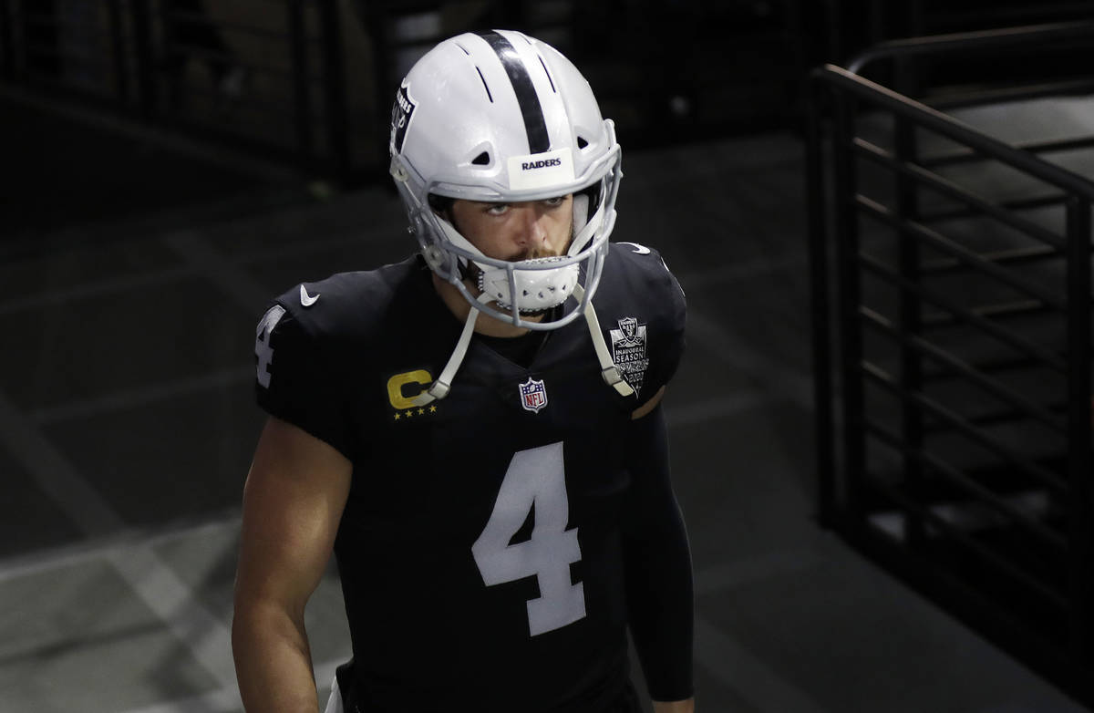 Las Vegas Raiders quarterback Derek Carr (4) walks onto the field before an NFL football game a ...