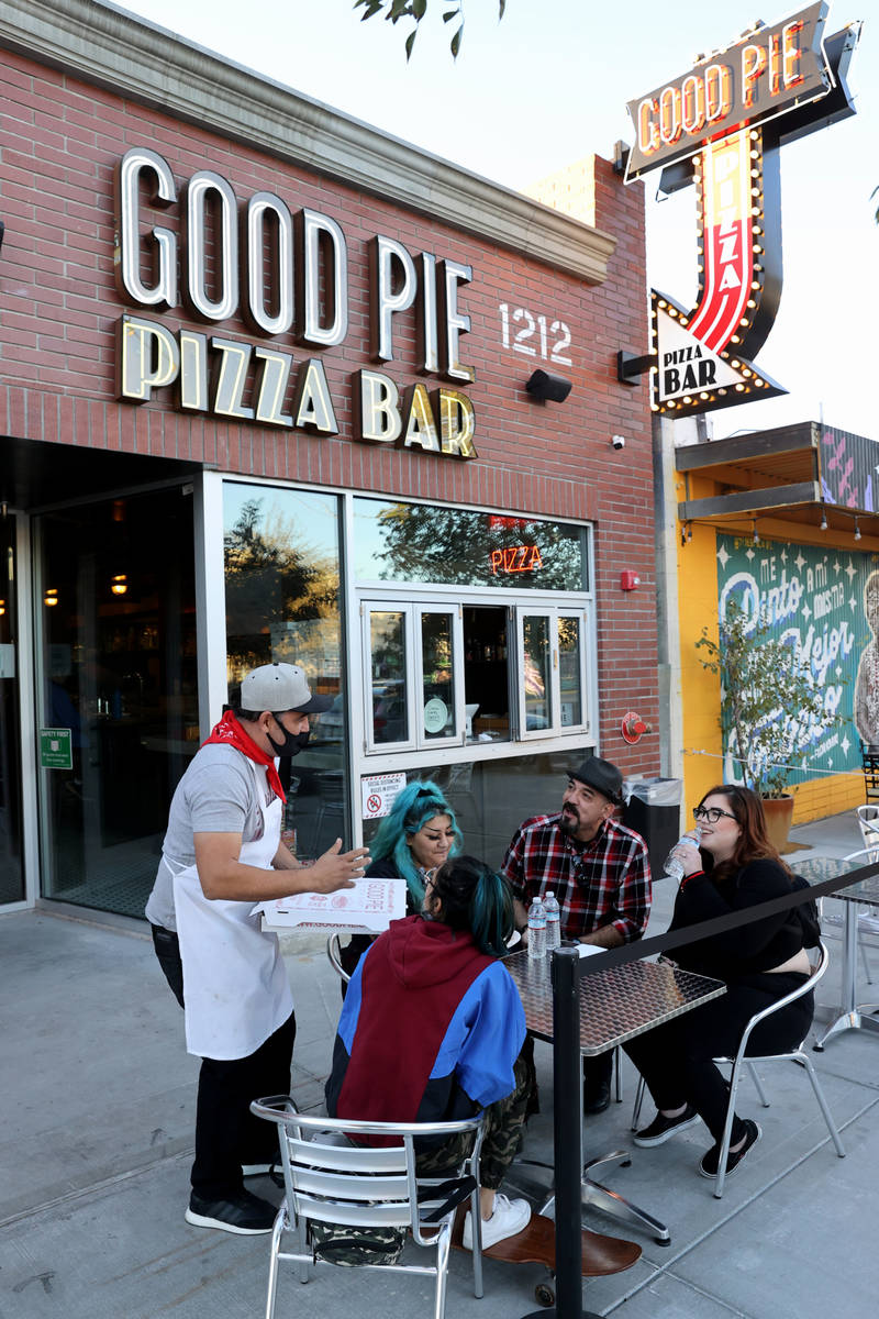 Good Pie owner Vincent Rotolo, standing, visits with Victoria Plascencia, from left, Tianna Sor ...