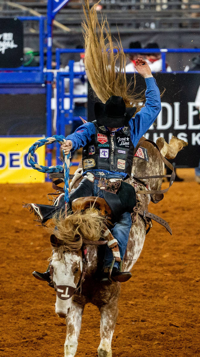 PRCA Saddle Bronc contestant Rusty Wright wins the first round of his event with a score of 86 ...