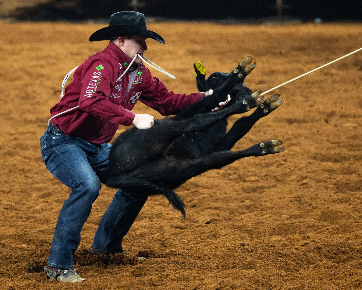 PRCA Tie Down Roping contestant Marty Yates wins the first round of his event with a time of 7. ...
