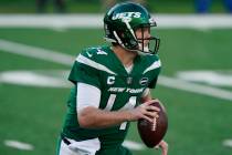 New York Jets quarterback Sam Darnold looks to throw during the first half of an NFL football g ...