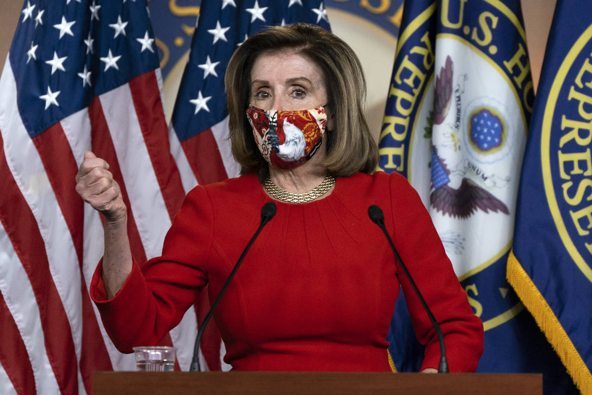 House Speaker Nancy Pelosi, of Calif., speaks during her weekly briefing, Friday, Dec. 4, 2020, ...