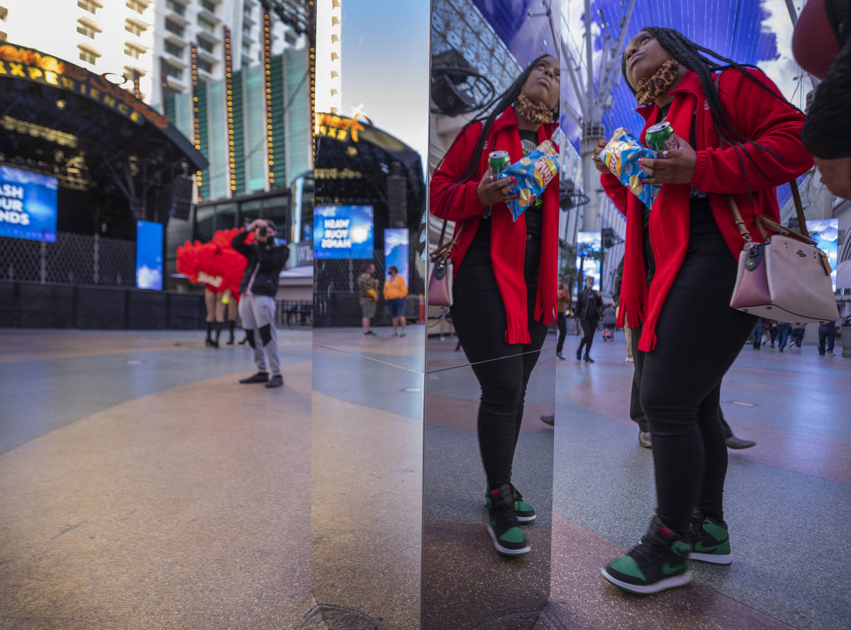 Ty Whiteside, 25, of Columbia, South Carolina, looks up at a 10-foot monolith standing under t ...