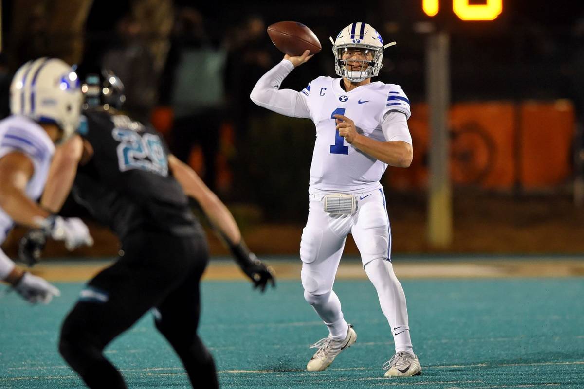 BYU quarterback Zach Wilson drops back to pass during the first half of an NCAA college footbal ...