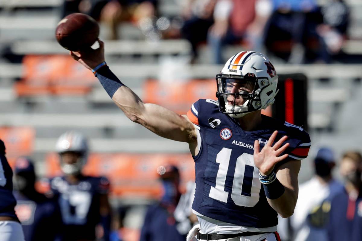 Auburn quarterback Bo Nix (10) throws a pass against Texas A&M during the first half of an NCAA ...