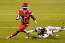 Kansas City Chiefs wide receiver Tyreek Hill (10) avoids Denver Broncos cornerback A.J. Bouye ( ...