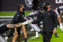 Las Vegas Raiders head coach Jon Gruden greets his players before the start of their NFL Footba ...