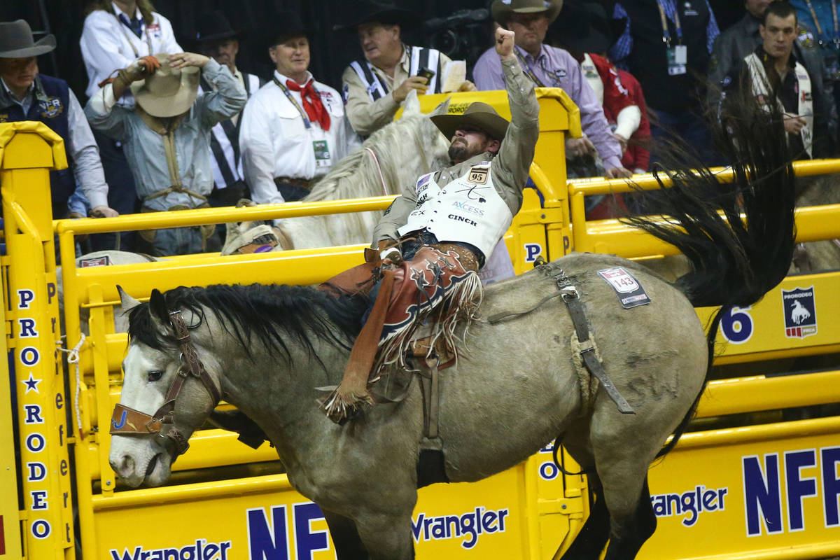 Mason Clements of Springville, Utah rides "Colorado Bulldog" while competing in bareb ...
