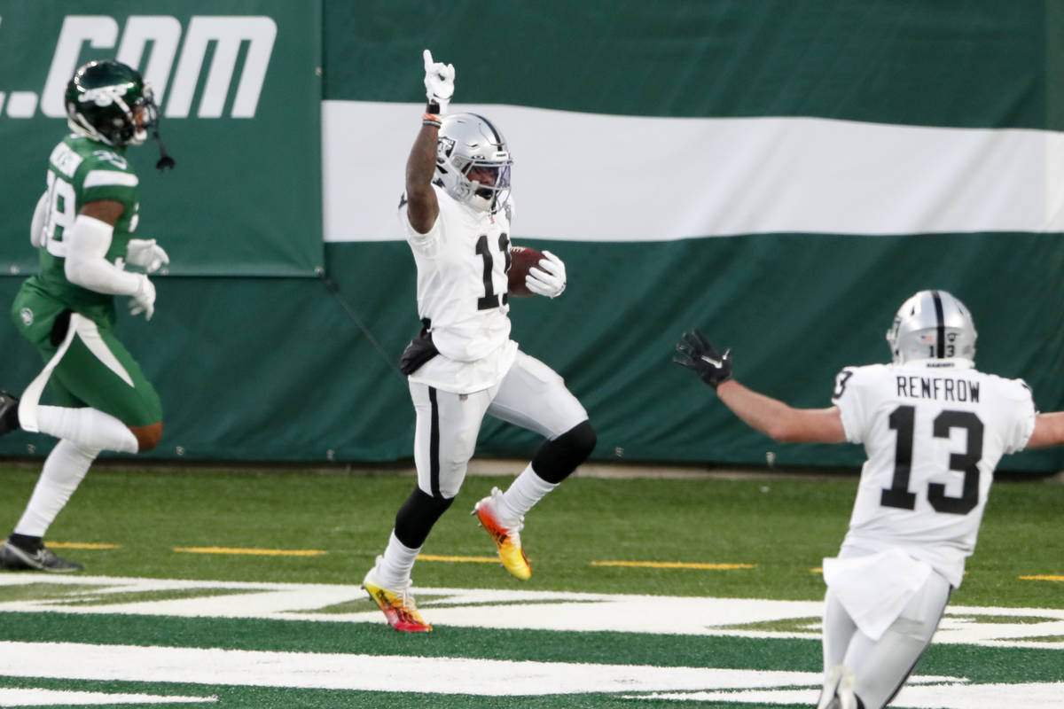 Las Vegas Raiders' Henry Ruggs III, center, celebrates his touchdown during the second half an ...