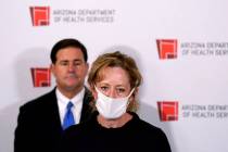 Department of Health Services Director Dr. Cara Christ speaks as Arizona Gov. Doug Ducey listen ...