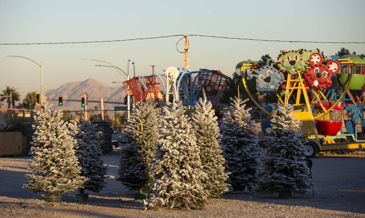 The sun sets on trees for sale at Rudolph's Christmas Trees on Saturday, Dec. 5, 2020, in Las V ...