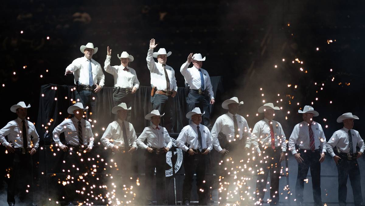 The Grand Entry performance lights up the 3rd go-round of the National Finals Rodeo in Arlingto ...